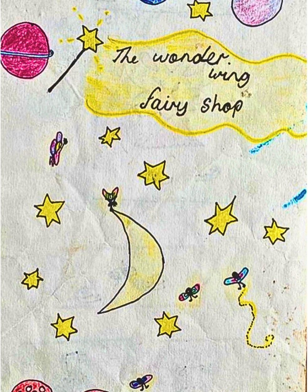 A child's crayon drawing of a fairy shop with planets, stars and toadstools